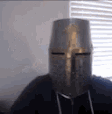 knight removing helmet to reveal another helmet